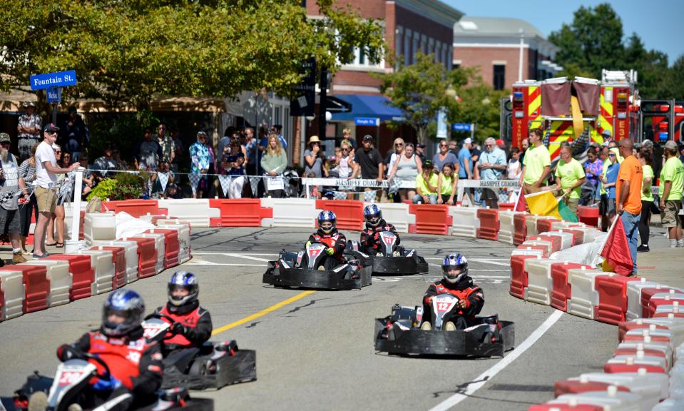 Drivers make their way around a curve in the track at the 2021 Seaside Le Mans - Race for the Community fundraiser at Mashpee Commons. This year's event on Saturday will benefit five Cape organization.