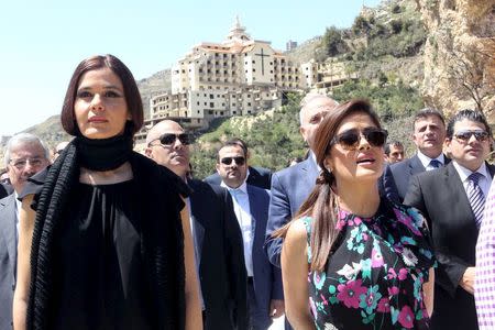 Actress Salma Hayek (R) sings the Mexican national anthem as she stands near Lebanese Member of Parliament Sethrida Geagea outside Khalil Gibran museum during a visit to promote her film "The Prophet" in Gibran's hometown of Bcharre, Lebanon April 26, 2015. REUTERS/Stringer