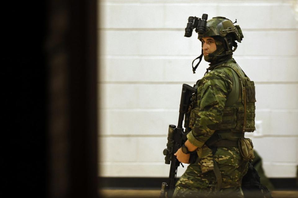 Officer in tactical gear on the scene (EPA)