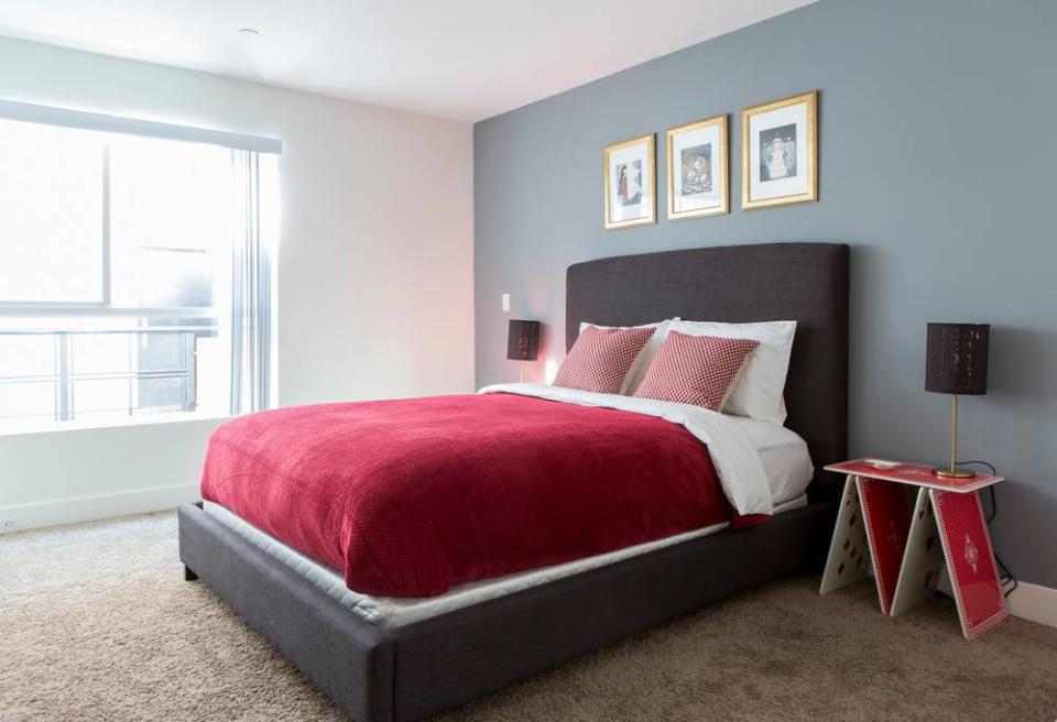 <p>There are three bedrooms in the home. The first is this Queen of Hearts suite, guarded by card soldiers at your bedside. (Airbnb) </p>