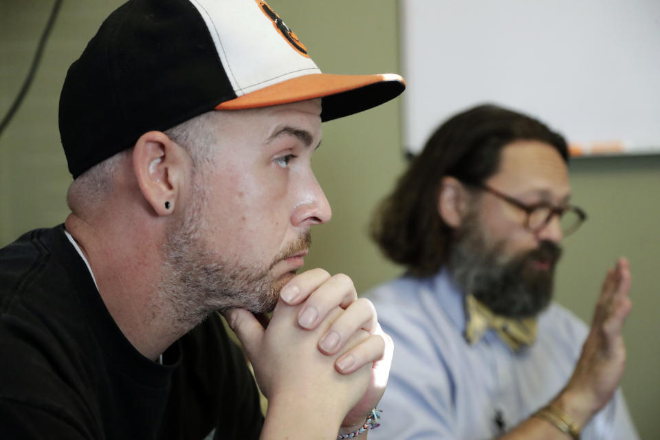 In this Oct. 8, 2018, photo, Tim Nolen, left, participates in a relapse prevention group session with counselor Bob Benson, right, at a treatment facility run by Buffalo Valley Inc. in Nashville, Tenn. Nolen has no health insurance coverage and his treatment for opioid addiction is funded by a grant program Congress approved in 2016 under the 21st Century Cures Act. (AP Photo/Mark Humphrey)