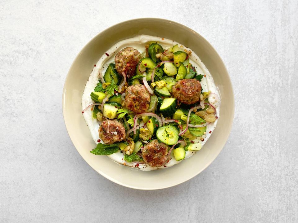 Juicy, oven-baked pork meatballs turn your summer cucumber haul into a satisfying meal. Swoosh the plate with yogurt before piling your cukes on top. <a href="https://www.epicurious.com/recipes/food/views/pork-meatballs-and-cucumber-salad?mbid=synd_yahoo_rss" rel="nofollow noopener" target="_blank" data-ylk="slk:See recipe.;elm:context_link;itc:0" class="link ">See recipe.</a>