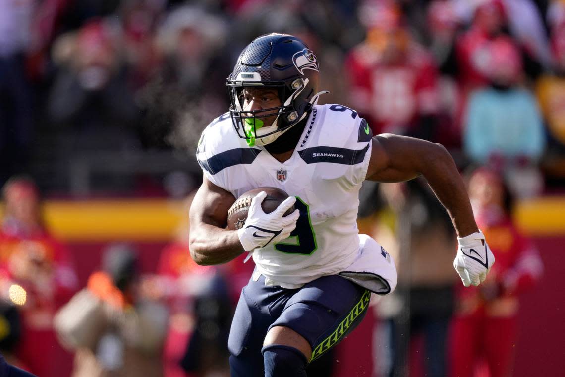 Seattle Seahawks running back Kenneth Walker III runs with the ball during the first half of an NFL football game against the Kansas City Chiefs Saturday, Dec. 24, 2022, in Kansas City, Mo. (AP Photo/Charlie Riedel)