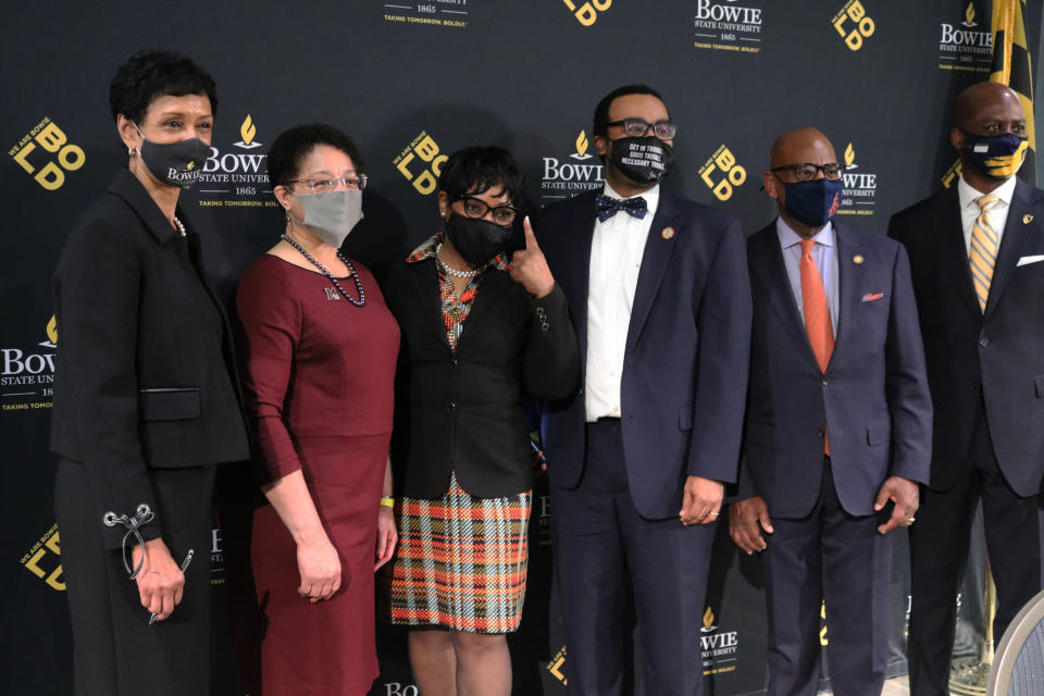 Maryland House Speaker Adrienne Jones, third from left, points up while standing with the presidents of Maryland's four historically Black colleges and Universities after a bill signing ceremony on Wednesday, March 24, 2021 in Bowie, Md. , to set aside $577 million over a decade to settle a federal lawsuit over underfunding at the state's HBCU's. From left: Aminta Breaux, president of Bowie State University, Heidi Anderson, president of the University of Maryland Eastern Shore, Jones, Sen. Charles Sydnor, David Wilson, president of Morgan State University, and Anthony Jenkins, president of Coppin State University. (AP Photo/Brian Witte)