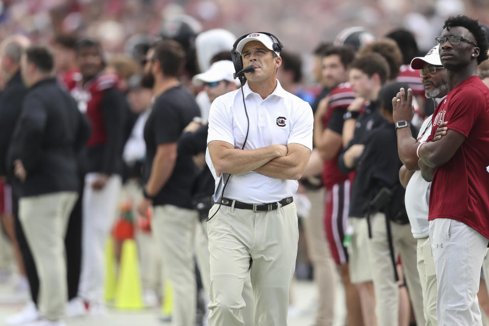 South Carolina head coach Shane Beamer checks the scoreboard during the first half of an NCAA college football game against Florida on Saturday, Oct. 14, 2023, in Columbia, S.C. (AP Photo/Artie Walker Jr.)