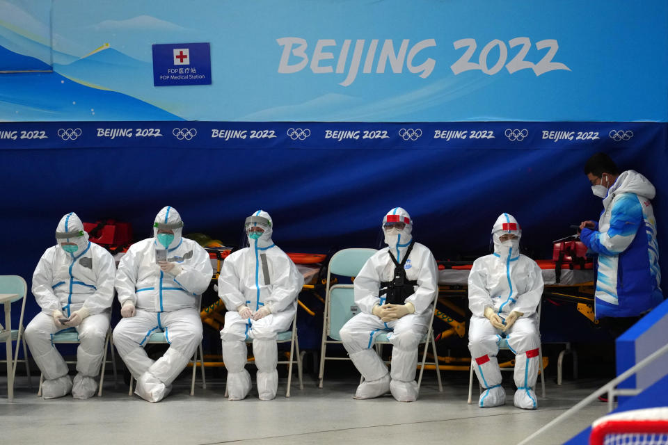 Medical staff wearing personal protective gear to protect against COVID-19 work at the National Indoor Stadium on February 3, 2022, in Beijing, China, one day before the opening ceremony of the Winter Olympics. / Credit: Getty Images