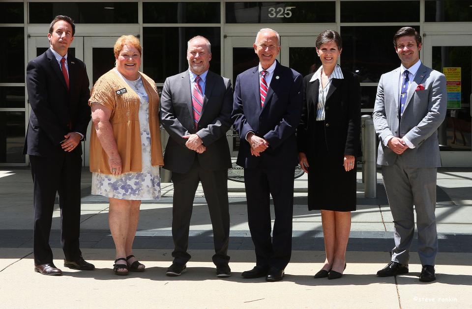 District Attorney Travis Page, Register of Deeds Susan Lockridge, Chief District Court Judge John Greenlee, Supreme Court Chief Justice Paul Newby, Clerk of Court Roxann Rankin and Superior Court Judge Jesse Caldwell pose for a photograph outside the Gaston County Courthouse.