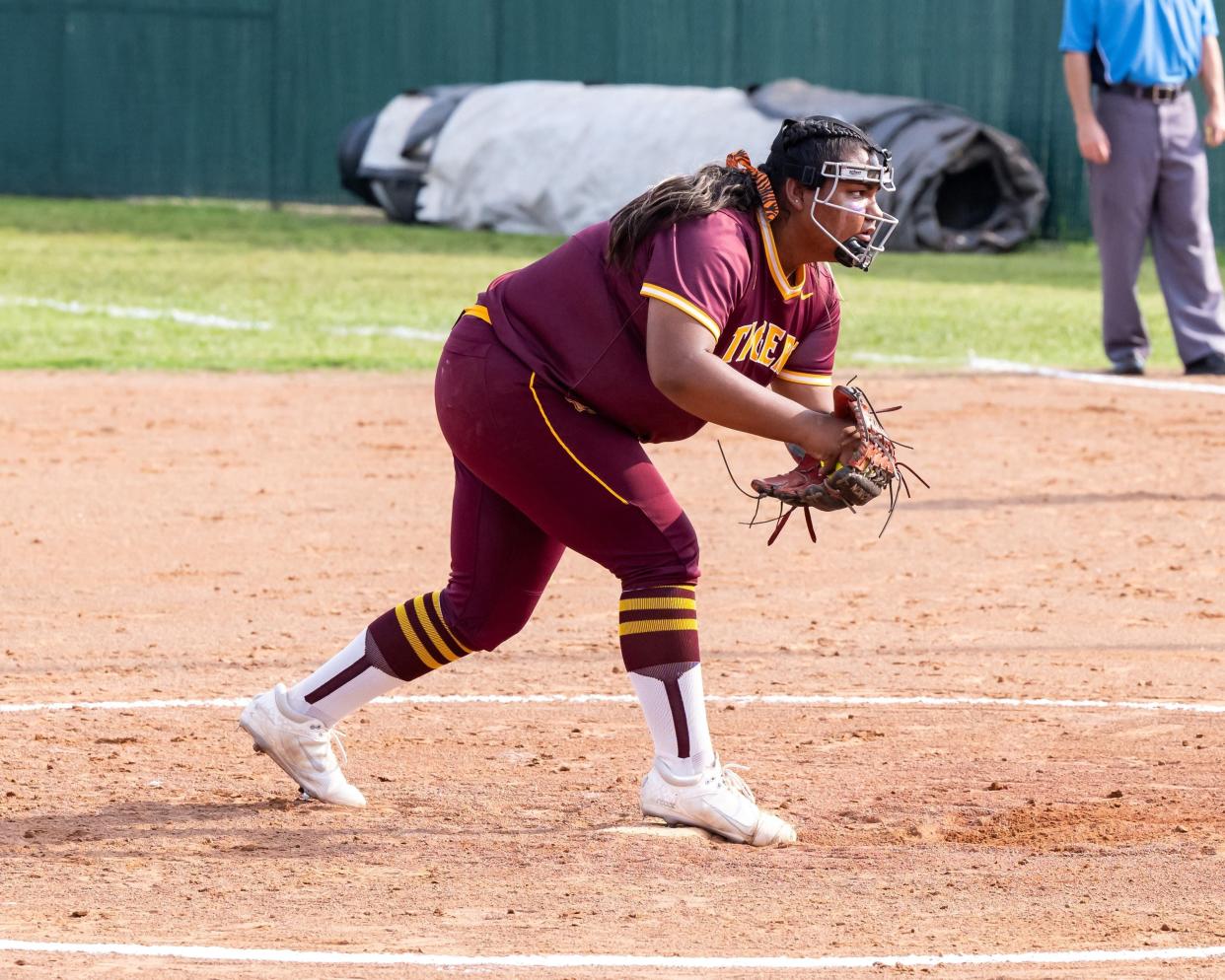 Dripping Springs pitcher Jai-Lynn Flores prepares to throw against a Round Rock hitter during last Friday's 11-1 bi-district playoff win at Round Rock High School. The state softball playoffs continue this week with the area round.