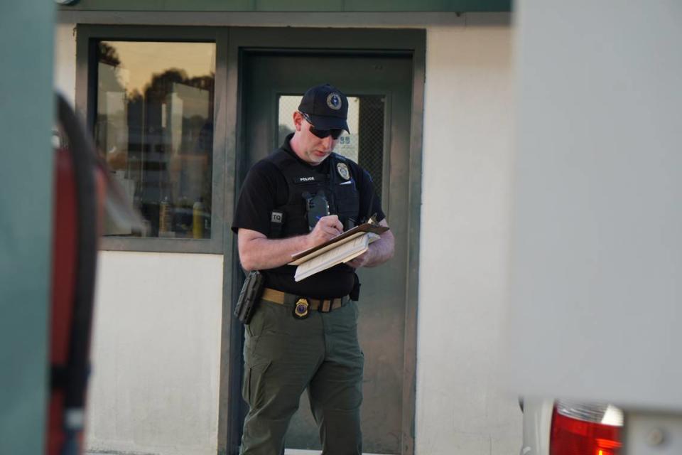 A member of the South Carolina Department Office of the Inspector General notes down the license plate information of a car being searched on Nov. 9, 2023. Ted Clifford