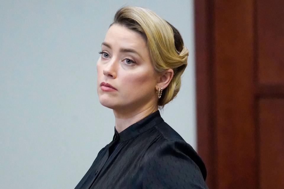 Actress Amber Heard stands in the courtroom at the Fairfax County Circuit Courthouse in Fairfax, Virginia, April 25, 2022.