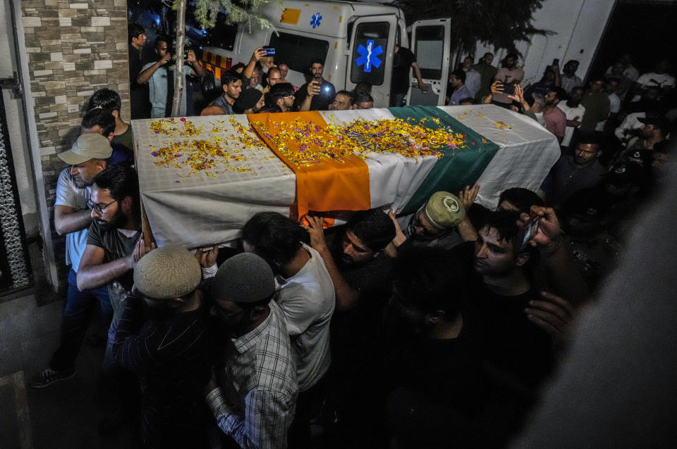 Relatives and colleagues carry the coffin of Indian police officer Humayun Bhat at his funeral outside his home on the outskirts of Srinagar, Indian controlled Kashmir, Wednesday, Sept 13, 2023. Three Indian soldiers and a police officer were killed in separate gunfights with rebels over the past two days in the mountainous Indian-controlled Kashmir, officials said Wednesday. (AP Photo/Mukhtar Khan)