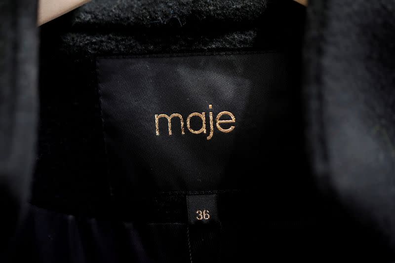 FILE PHOTO: A Maje label is pictured on clothes inside a Maje luxury clothing store, operated by SMCP Group, in Paris