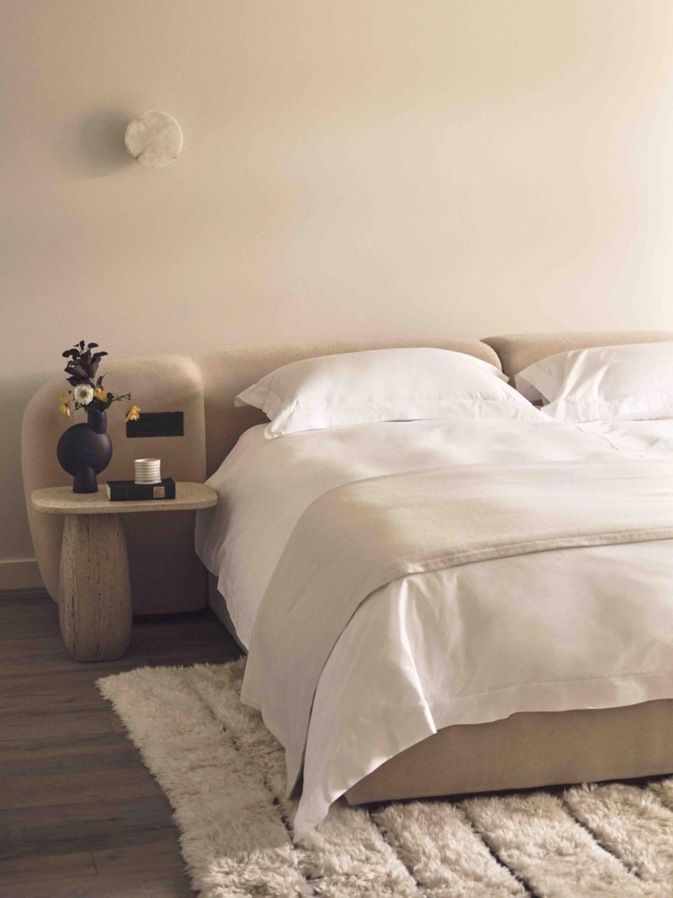 a bed with a white duvet