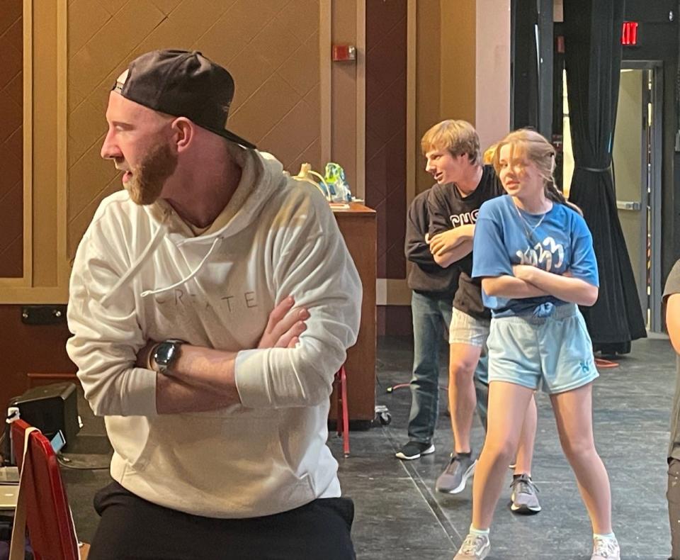 Kyle Aiden, left, is volunteering his time to put together the choreography for the Aberdeen Community Theatre production of "Matilda," which opens Tuesday. Behind Aiden, from left, are cast members Damon Sheets and Charlie Hemke.