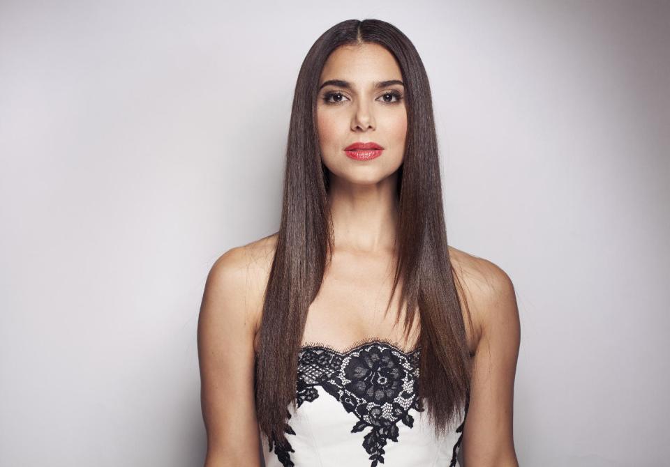 This June 19, 2013 photo shows actress Roselyn Sanchez in New York. Sanchez stars in the series, "Devious Maids," airing Sundays at 10 p.m. EST on Lifetime. (Photo by Taylor Jewell/Invision/AP)