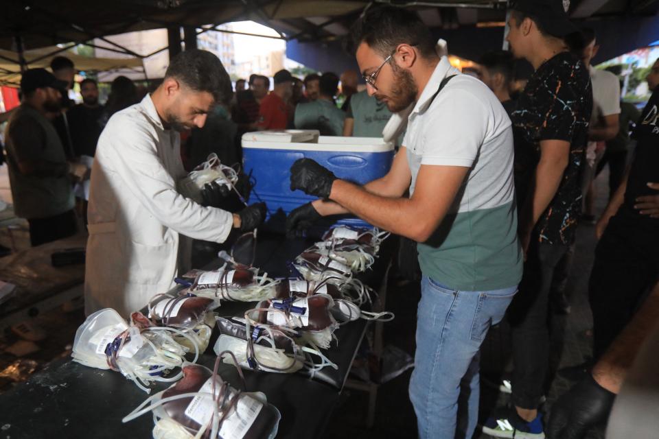 Medics collect blood donations in Beirut’s southern suburb on 17 September 2024, after explosions hit locations in several Hezbollah strongholds around Lebanon (AFP via Getty Images)