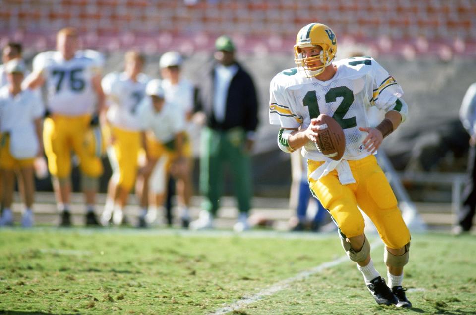 PASADENA, CA - NOVEMBER 16:  Quarterback Brett Salisbury #12 of the Oregon Ducks drops back to pass during the game against the UCLA Bruins at the Rose Bowl on November 16, 1991 in Pasadena, California. The Bruins defeated the Ducks 16-7.  (Photo by Bernstein Associates/Getty Images)