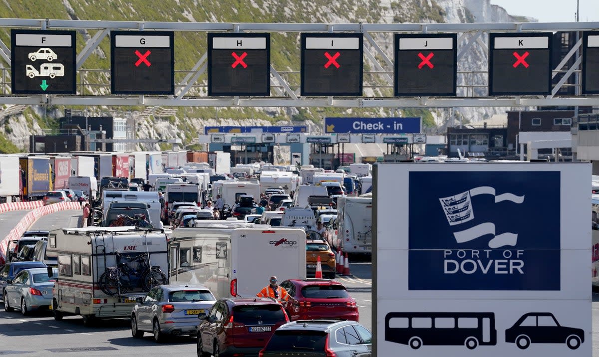 Vehicles queue for ferries at the Port of Dover, Kent, where passengers are facing up to a two-hour wait for checks by French border officials (PA)