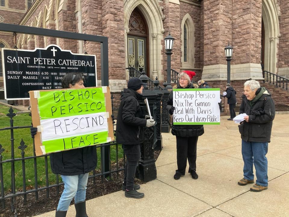 Protesters, rallying against the lease agreement between Gannon University and Erie County, demonstrate outside St. Peter Cathedral on Dec. 10, 2023.