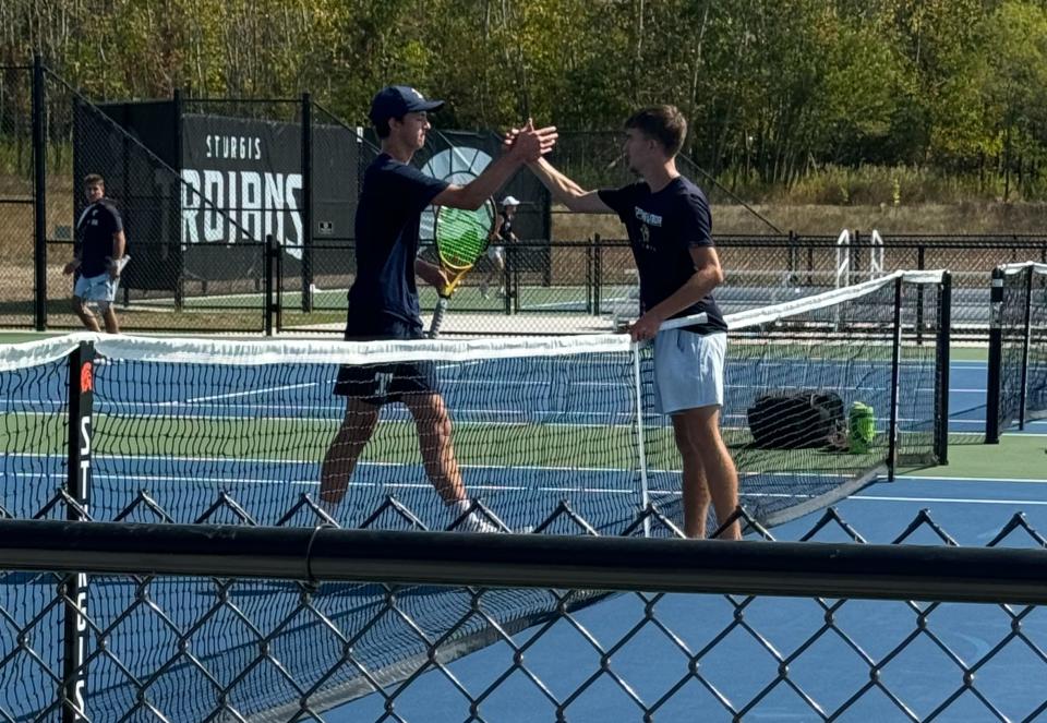 Sturgis graduates Walter Ebert and Christian Perry played a match at the new tennis courts on Tuesday. Ebert won in straight sets.