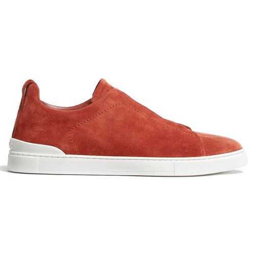 <p><a class="link " href="https://www.zegna.com/uk-en/product.zegna-male-dark-orange-suede-triple-stitch-low-top-sneakers-dark-orange-9.22322711/?ds_cid=71700000056919174&gclid=CjwKCAjwkaSaBhA4EiwALBgQaIg_axi7yKU_ME3RM-TCx0S2TKik7fSehCDelEGTrqG8ry9Kptiz2RoCFIQQAvD_BwE&gclsrc=aw.ds" rel="nofollow noopener" target="_blank" data-ylk="slk:SHOP;elm:context_link;itc:0;sec:content-canvas">SHOP</a></p><p>It's common knowledge that Zegna is adept at crafting a nice bit of clobber, but did you know they're also in on the sneaker game? Enter the Triple Stitch trainer: Zegna's finest casual footwear offering to date. </p><p>£710; <a href="https://www.zegna.com/uk-en/product.zegna-male-dark-orange-suede-triple-stitch-low-top-sneakers-dark-orange-9.22322711/?ds_cid=71700000056919174&gclid=CjwKCAjwkaSaBhA4EiwALBgQaIg_axi7yKU_ME3RM-TCx0S2TKik7fSehCDelEGTrqG8ry9Kptiz2RoCFIQQAvD_BwE&gclsrc=aw.ds" rel="nofollow noopener" target="_blank" data-ylk="slk:zegna.com;elm:context_link;itc:0;sec:content-canvas" class="link ">zegna.com</a></p>
