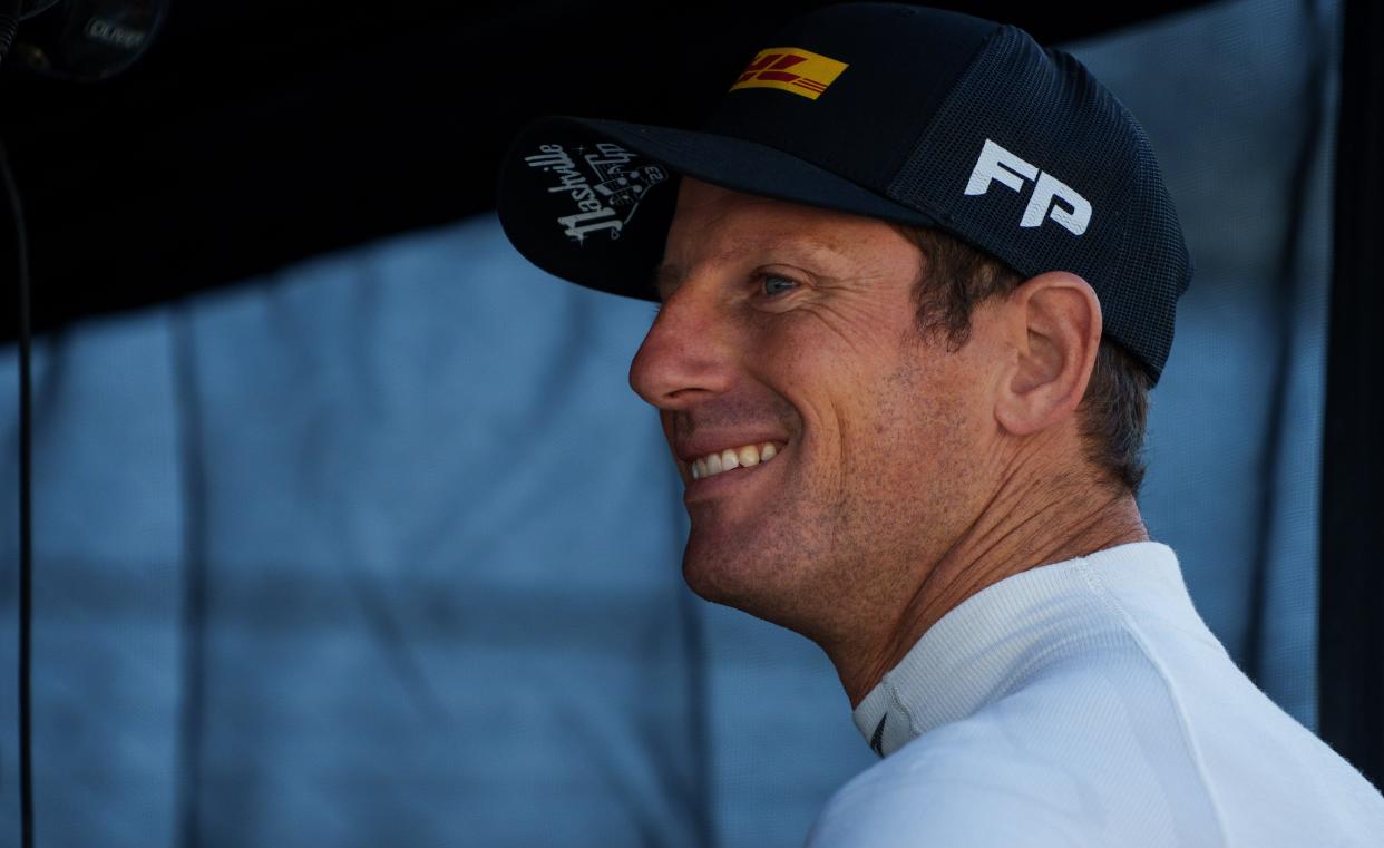 Andretti Autosport driver Romain Grosjean (28) talks with crew members Friday, Aug. 11, 2023, ahead of practice for the Gallagher Grand Prix at Indianapolis Motor Speedway. 