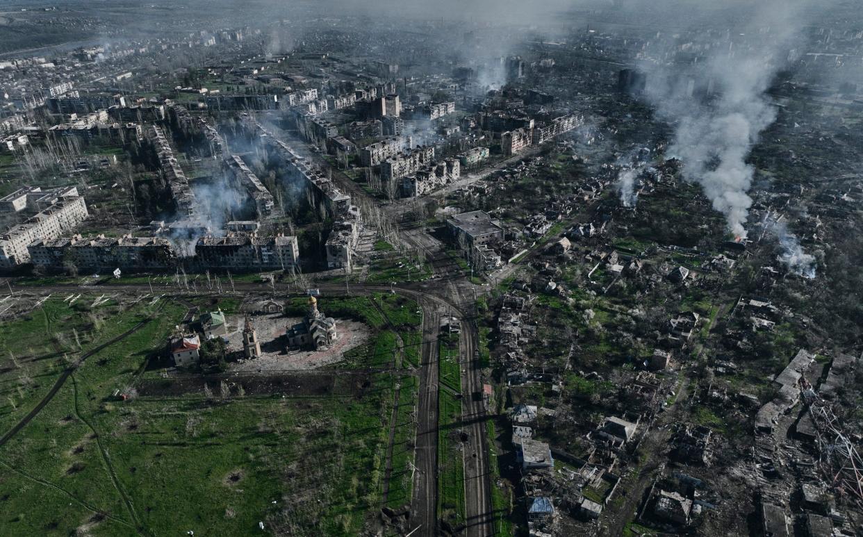 Smoke rises from buildings in this aerial view of Bakhmut, the site of heavy battles between Ukrainian and Russian troops - Libkos/AP