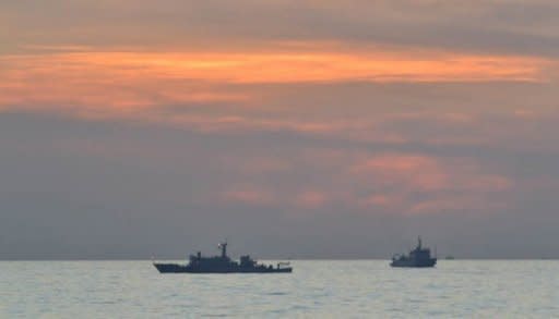 Chinese surveillance ships are seen off the disputed Scarborough Shoal, close to the Philippines, in April. China on Saturday attacked US criticism of its decision to set up a new military garrison in the South China Sea, saying it sent the "wrong signal" and threatened peace in the hotly disputed waters