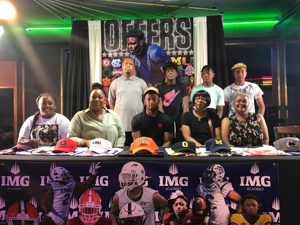 IMG Academy standout Keon Sabb (front and center) decommitted from Clemson Monday. Here he poses for pictures with his family after initially committing to Clemson. Top row (from left): Antoine Sabb, Amari Sabb, Xavier Sabb and Khamia Hitton. Bottom row: Naiyana Sabb, Quiana Sabb, Keon Sabb, Gwen Sabb and Vonnie Hitton.