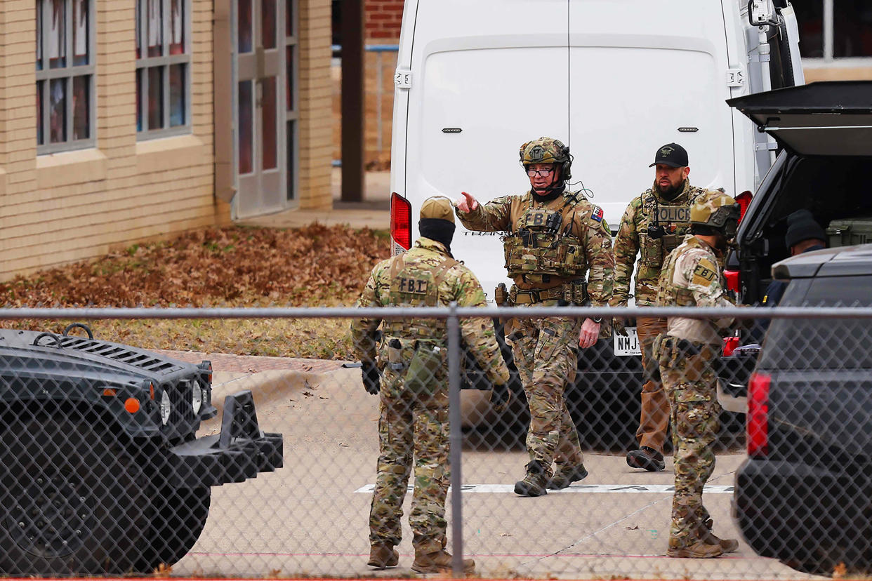 SWAT team members deploy near the Congregation Beth Israel Synagogue in Colleyville, Texas, on Jan. 15, 2022. (Andy Jacobsohn / AFP - Getty Images)