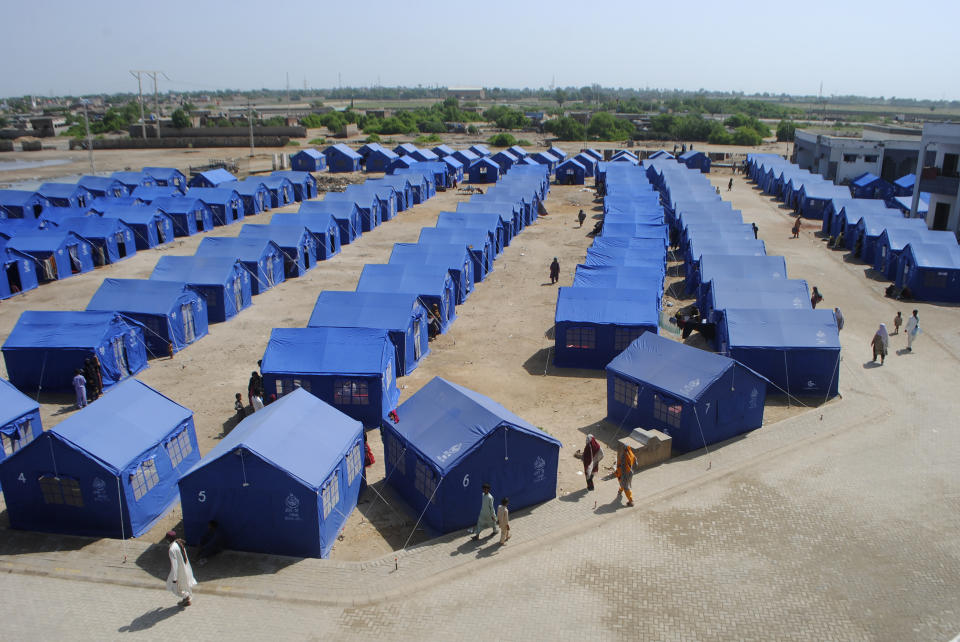 Temporary housing is constructed for flood victims in Hyderabad, Pakistan, Tuesday, Sept. 6, 2022. In flood-stricken Pakistan where an unprecedented monsoon season has already killed hundreds of people, the rains are now threatening an ancient archeological site dating back 4,500 years, the site's chief official said Tuesday. (AP Photo/Pervez Masih)