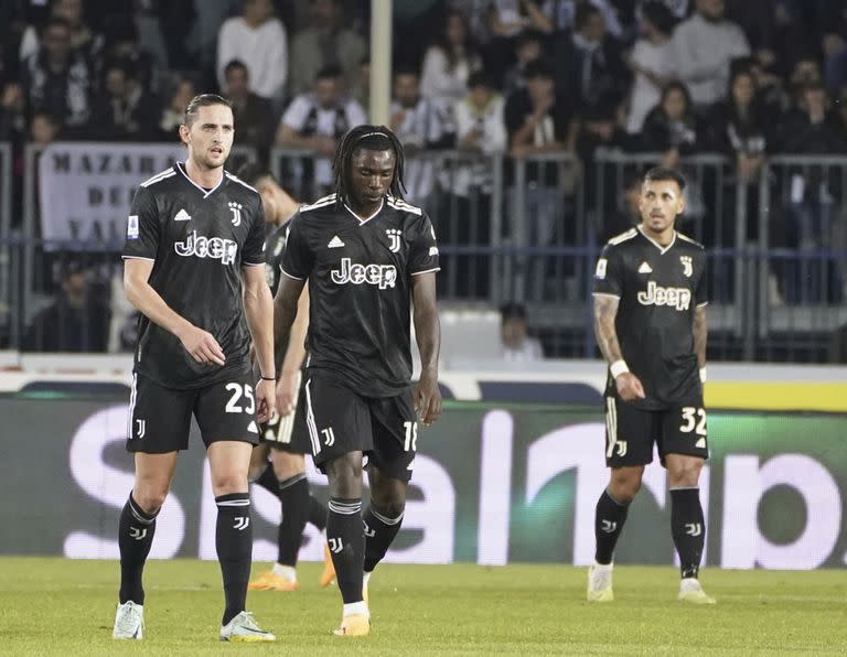 Juventus' players, Adrien Rabiot, from left, Moise Kean, and Leandro Paredes, are disappointed after Empoli's goal of 4-1, during the Italian Serie A soccer match between Empoli and Juventus, at the Carlo Castellani stadium in Empoli, Italy, Monday, May 22, 2023. (Marco Bucco/LaPresse via AP)