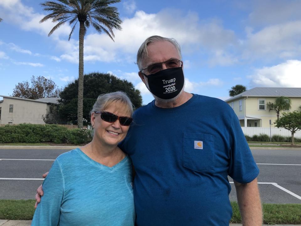 Maria and Gabe Goodman, residents of Neptune Beach, Fla., cast their ballots for President Trump early.