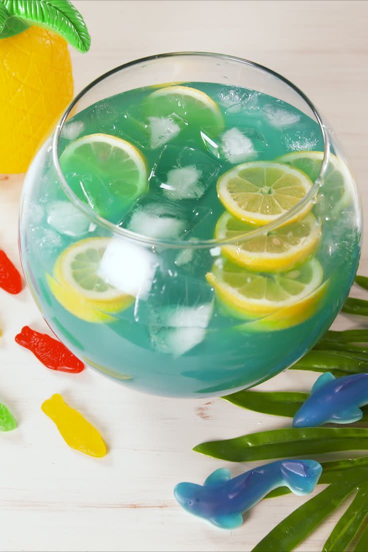 <p>A perfect<a href="https://www.delish.com/entertaining/g1127/big-batch-summer-cocktail-recipes/" rel="nofollow noopener" target="_blank" data-ylk="slk:big-batch recipe" class="link "> big-batch recipe</a> for a party, this fishbowl is based on the classic drink, the <a href="https://www.delish.com/cooking/recipe-ideas/a28008396/blue-hawaiian-coolers-recipe/" rel="nofollow noopener" target="_blank" data-ylk="slk:Blue Hawaiian" class="link ">Blue Hawaiian</a>, which is composed of <a href="https://www.delish.com/entertaining/g32009640/best-rum-brands/" rel="nofollow noopener" target="_blank" data-ylk="slk:rum" class="link ">rum</a>, blue curaçao, and sometimes <a href="https://www.delish.com/entertaining/g31213317/best-vodka-brands/" rel="nofollow noopener" target="_blank" data-ylk="slk:vodka" class="link ">vodka</a>. <br><br>Get the <strong><a href="https://www.delish.com/cooking/recipe-ideas/a19694173/boozy-fishbowl-recipe/" rel="nofollow noopener" target="_blank" data-ylk="slk:Boozy Fishbowl recipe" class="link ">Boozy Fishbowl recipe</a>.</strong> </p>