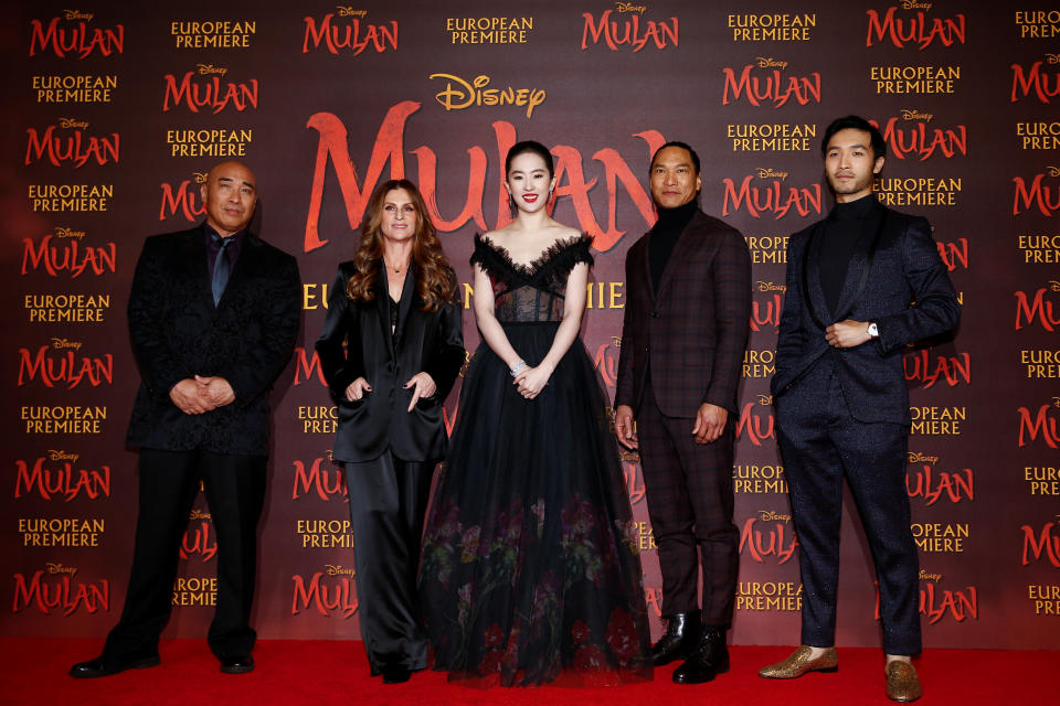 Cast members Ron Yuan, Yifei Liu, Jason Scott Lee and Yoson An pose with director Niki Caro, at the European premiere for the film "Mulan" in London, Britain March 12, 2020. 