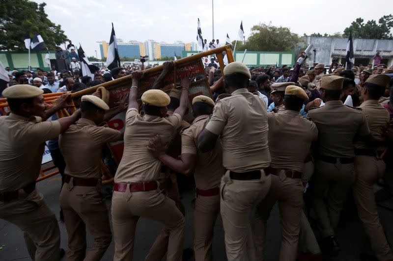 Police stop demonstrators during a protest against a new citizenship law, in Chennai