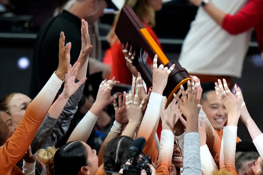 Texas players celebrate after winning the NCAA Division I women’s college volleyball tournament against Nebraska Sunday, Dec. 17, 2023, in Tampa, Fla. (AP Photo/Chris O’Meara)