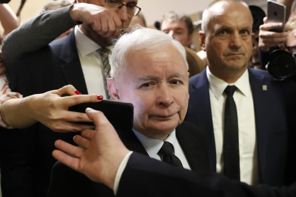 The ruling party leader Jaroslaw Kaczynski leaves polling station after his vote in Warsaw, Poland, Sunday, Oct. 13, 2019. Poles are voting Sunday in a parliamentary election that Kaczynski is favored to win easily, buoyed by the popularity of its social conservatism and generous social spending policies that have reduced poverty. (AP Photo/Darko Bandic)