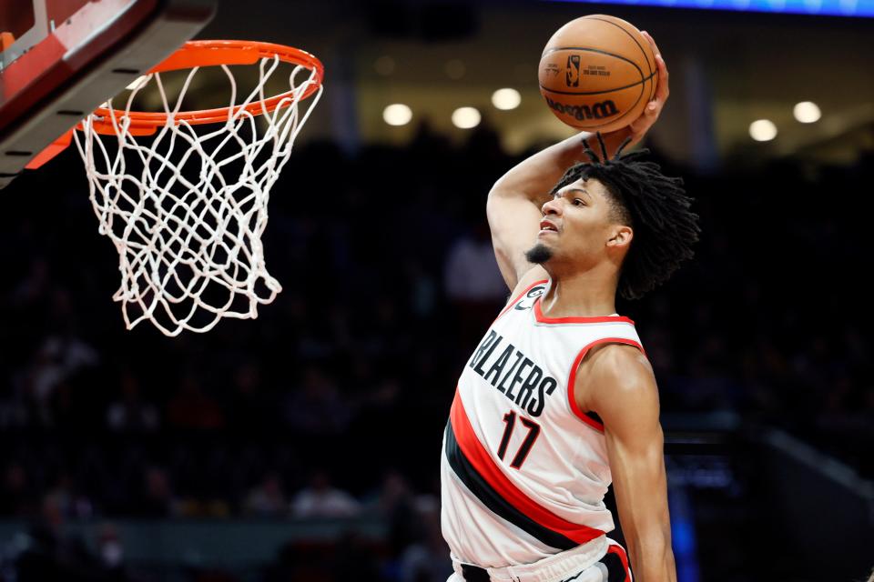 Oct 28, 2022; Portland, Oregon, USA; Portland Trail Blazers shooting guard Shaedon Sharpe (17) goes up for a dunk against the Houston Rockets during the first half at Moda Center.