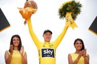 Cycling - The 104th Tour de France cycling race - The 103-km Stage 21 from Montgeron to Paris Champs-Elysees, France - July 23, 2017 - Team Sky rider and yellow jersey Chris Froome of Britain celebrates his overall win on the podium. REUTERS/Benoit Tessier