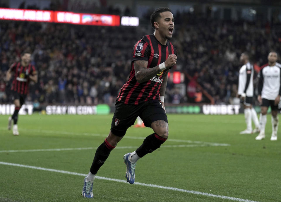 Bournemouth's Justin Kluivert celebrates scoring his side's first goal of the game during the English Premier League soccer match between Fulham FC and AFC Bournemouth at the Vitality Stadium, in Bournemouth, England, Tuesday Dec. 26, 2023. (Adam Davy/PA via AP)