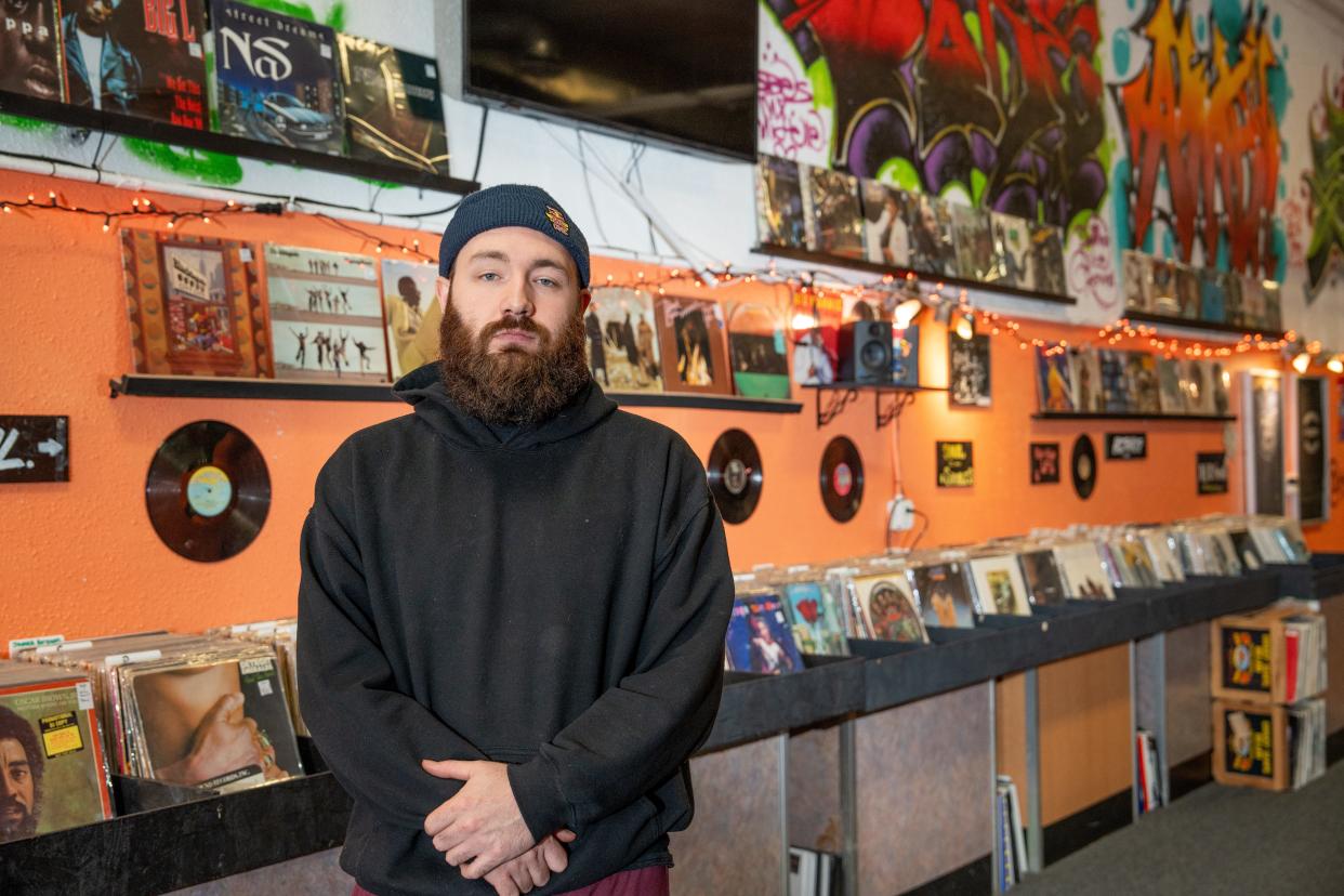 Zachary Grashel poses for a photo in his record store, The Kutt Records, on Oct. 14, 2023.