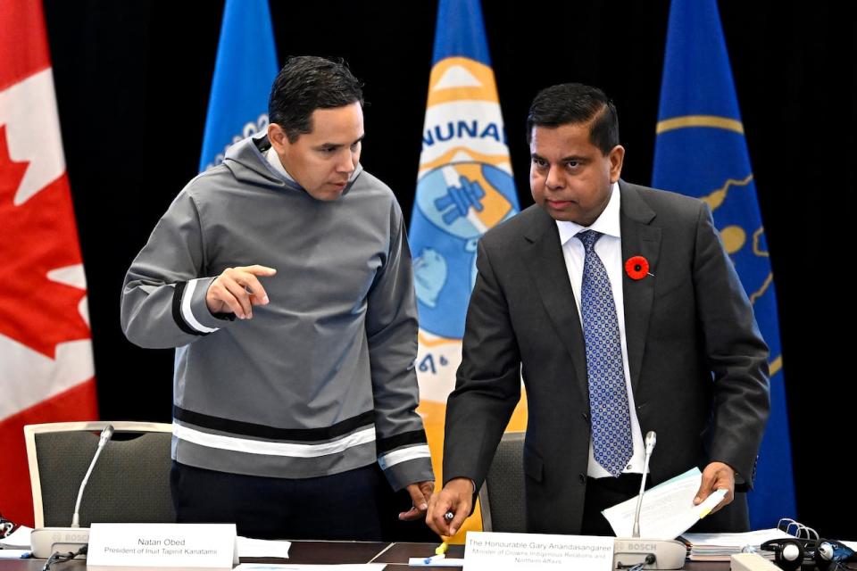 President of Inuit Tapiriit Kanatami Natan Obed, left, and Minister of Crown-Indigenous Relations Gary Anandasangaree take their seats at the Inuit-Crown Partnership Committee in Ottawa on Oct. 30, 2023.