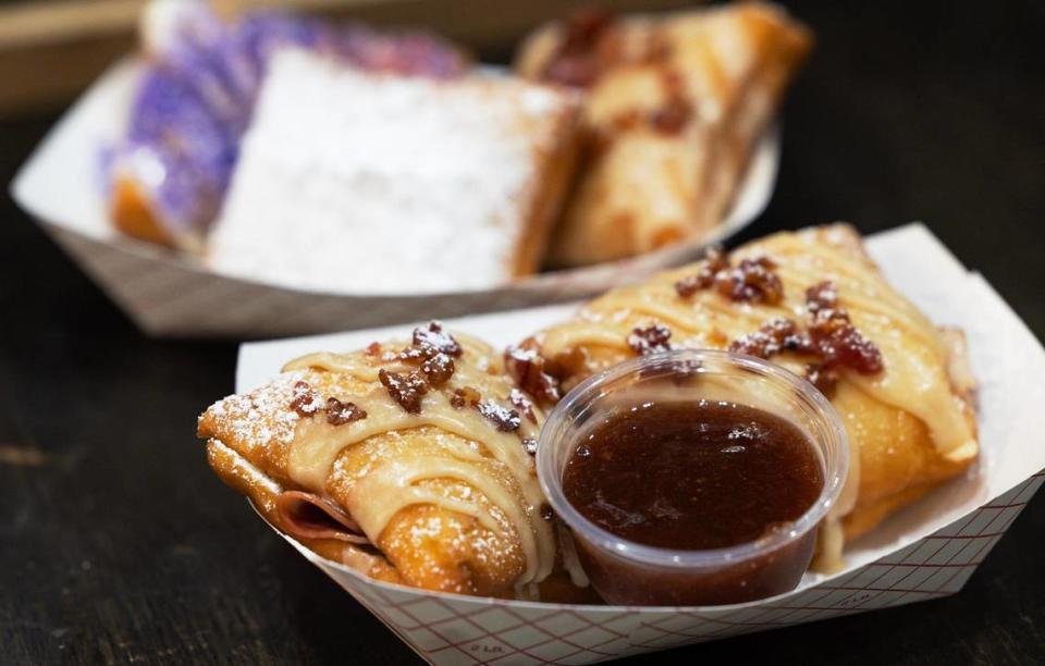 The Bourbon Street beignets, featuring a bourbon maple glaze with chopped bacon, at Dusty Biscuit Beignet on Friday, November 17, 2023. Dusty Biscuit Beignet is the winner of the Star-Telegram’s Readers Choice for favorite donut shop.