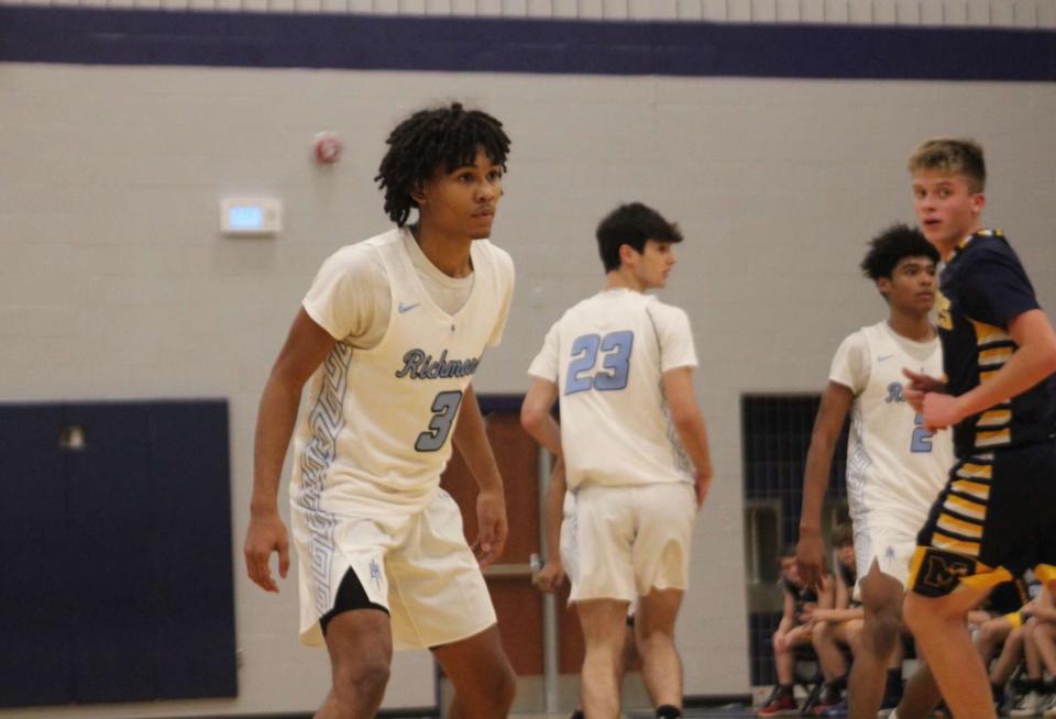 Richmond's Marcus Thompson sets up defensively during a game earlier this season. The guard finished with six points, seven assists and five rebounds in the 
Blue Devils' 51-49 win over Almont on Friday.