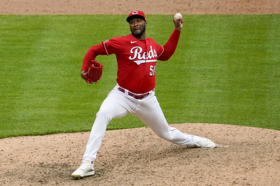 Cincinnati Reds relief pitcher Amir Garrett throws in the 10th inning during a baseball game against the Chicago Cubs in Cincinnati on Sunday, May 2, 2021. (AP Photo/Jeff Dean)