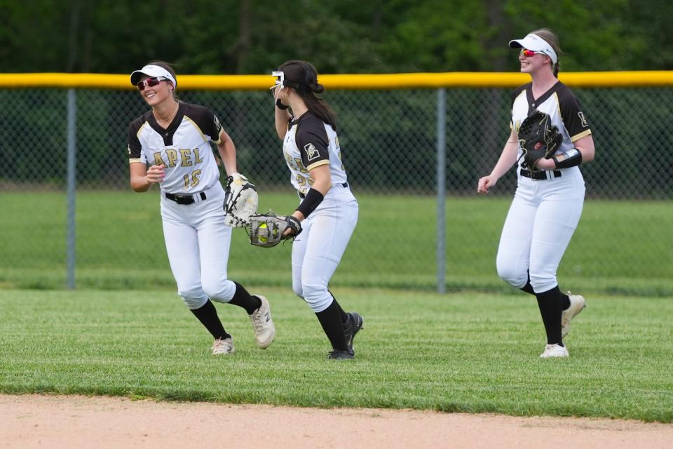 Lapel High School Bulldogs Taylor Mroz (16), Lapel High School Bulldogs Paige Stires (25) and Lapel High School Bulldogs Ava Everman (18) celebrate after making the final out of the inning against the Eastern Hancock Royals on Friday, May 3, 2024, during the varsity girls softball game at Lapel High School in Lapel, Indiana. The Eastern Hancock Royals defeated the Lapel High School Bulldogs 2-1.