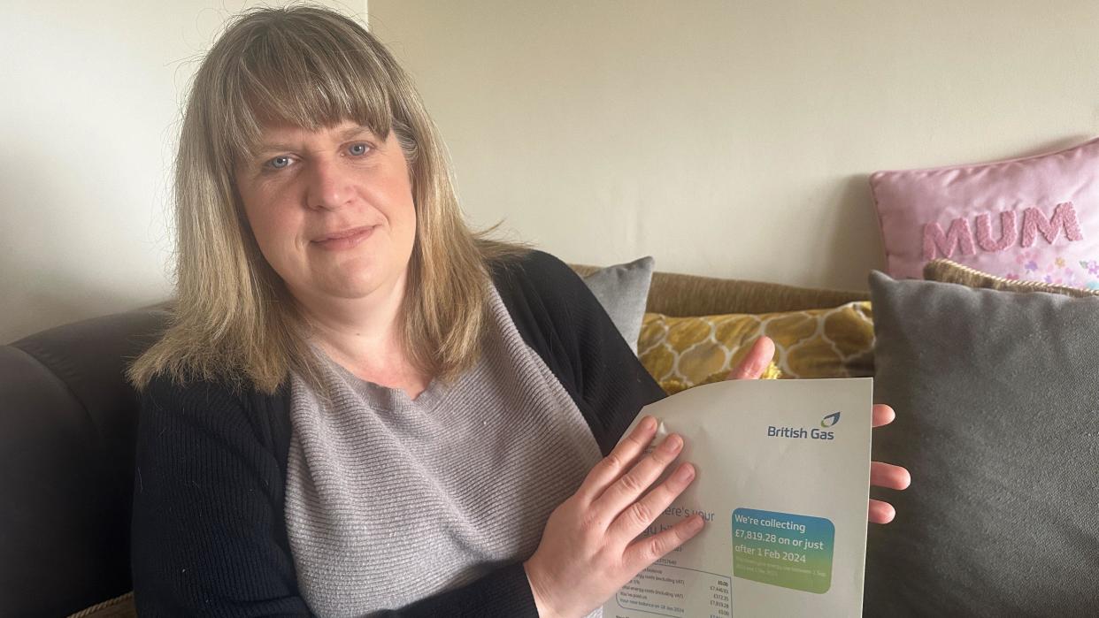 Rebekah Watson holding a British Gas bill