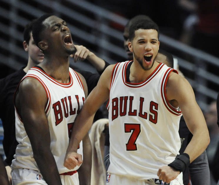 Bobby Portis and Michael Carter-Williams celebrate the Bulls’ luck. (AP)