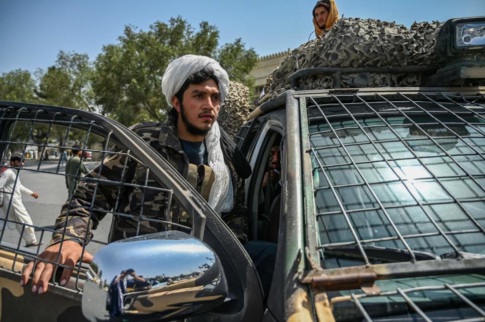 Taliban fighters keep watch along a street at the Massoud Square in Kabul on August 16, 2021. (Wakil Kohsar/AFP via Getty Images)